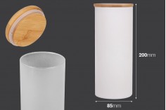 Staklena okrugla tegla 85x200 mm u raznim bojama sa drvenim poklopcem sa sigurnosnom gumicom