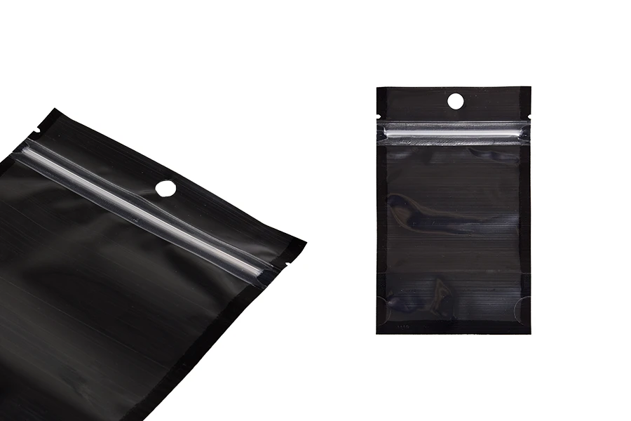 Aluminijumske DoyPack kesice sa zipom, crnom zadnjom i transparentnom prednjom stranom, ovalnim dnom i sa mogućnošću termo zatvaranja 80x30x130mm - 100kom Aluminijumske DoyPack kesice sa zipom, crnom zadnjom i transparentnom prednjom stranom, ovalnim dnom i sa mogućnošću termo zatvaranja 80x30x130mm - 100kom