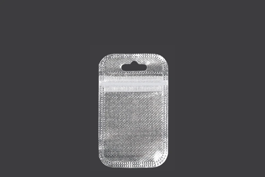 Kesica 55x90mm sa zip zatvaranjem, srebrnom non woven zadnjom i providnom prednjom stranom i sa Eurohole otvorom - 100 kom Kesica 55x90mm sa zip zatvaranjem, srebrnom non woven zadnjom i providnom prednjom stranom i sa Eurohole otvorom - 100 kom