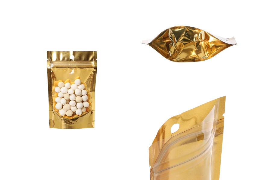 Aluminijumske DoyPack kesice sa zip zatvaranjem, zlatnom zadnjom i transparentnom prednjom stranom, ovalnim dnom i sa mogućnošću termo lepljenja 90x30x140mm – 100kom Aluminijumske DoyPack kesice sa zip zatvaranjem, zlatnom zadnjom i transparentnom prednjom stranom, ovalnim dnom i sa mogućnošću termo lepljenja 90x30x140mm – 100kom