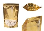 Aluminijumske DoyPack kesice sa zip zatvaranjem, zlatnom zadnjom i transparentnom prednjom stranom, ovalnim dnom i sa mogućnošću termo lepljenja 180x50x280mm – 100kom