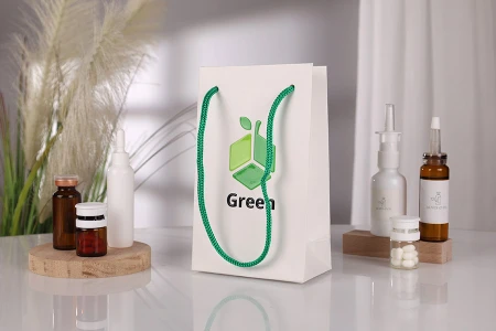 Papirna bela poklon kesa 110x60x180mm sa zelenom drškom - 20 kom-grupa_slika