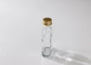 Staklena flašica 100mL u obliku pljoske Staklena flašica 100mL u obliku pljoske-slika_360